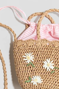 Sac à bandoulière en paille avec appliqués