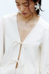 Tie-detail broderie anglaise jacket