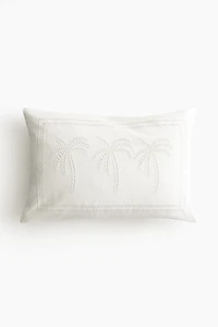 Housse de coussin avec broderie anglaise