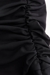 Robe dos nu à effet drapé