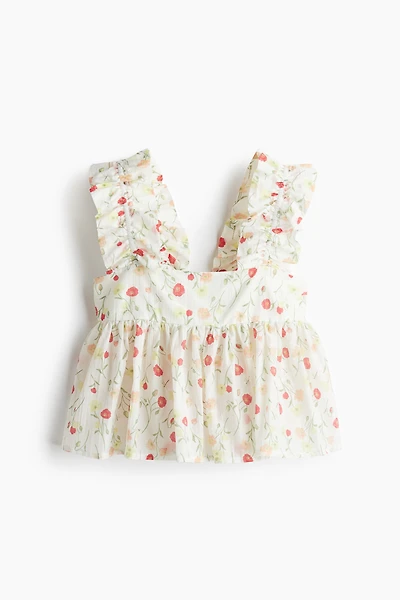 Haut péplum à effet plissé