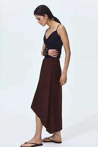 Jupe asymétrique avec panneau drapé