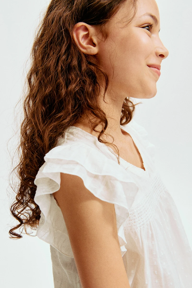 Blouse à manches volantées