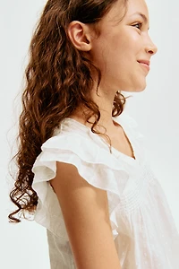 Blouse à manches volantées