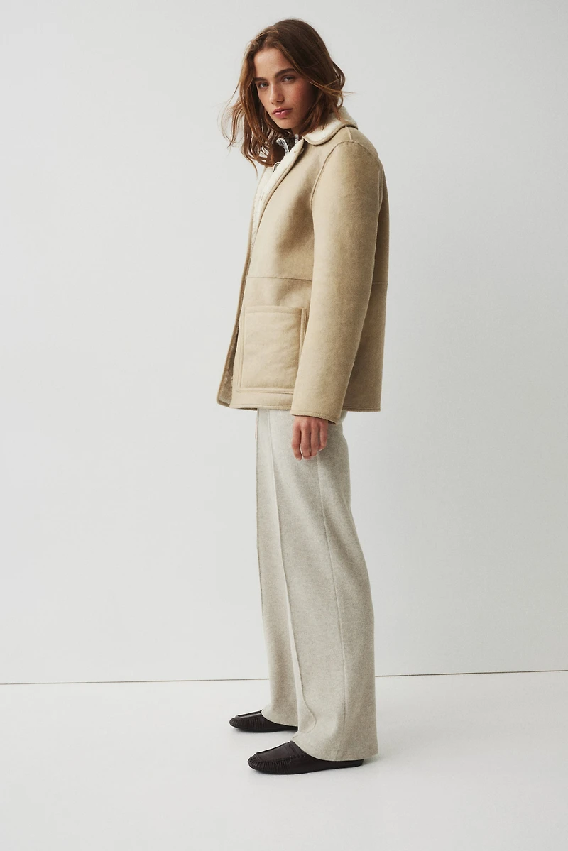 Pantalon en maille côtelée avec plis