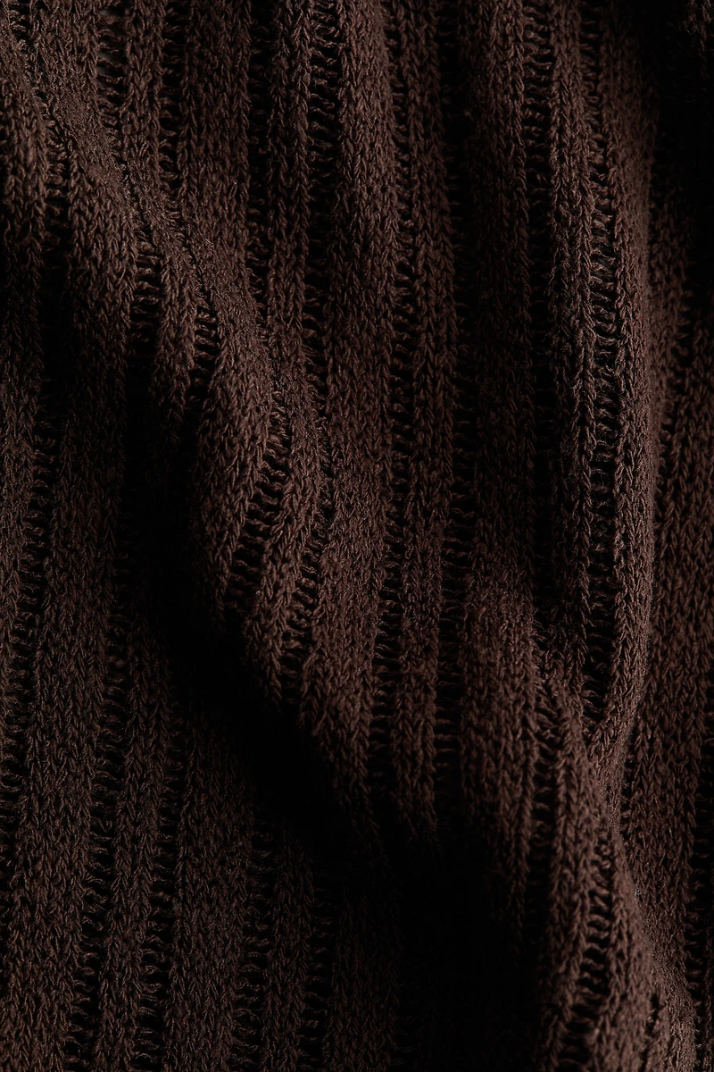 Cape en tricot côtelé