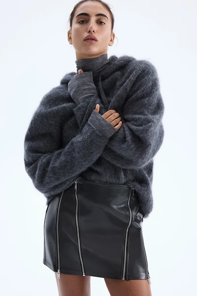 Jupe en tissu enduit avec fermetures éclair