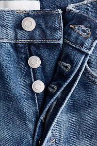 Jean tonneau en haut de la cheville