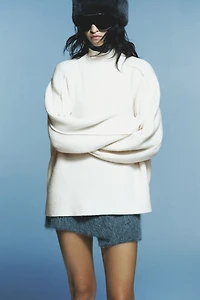 Chandail en tricot côtelé à col cheminée