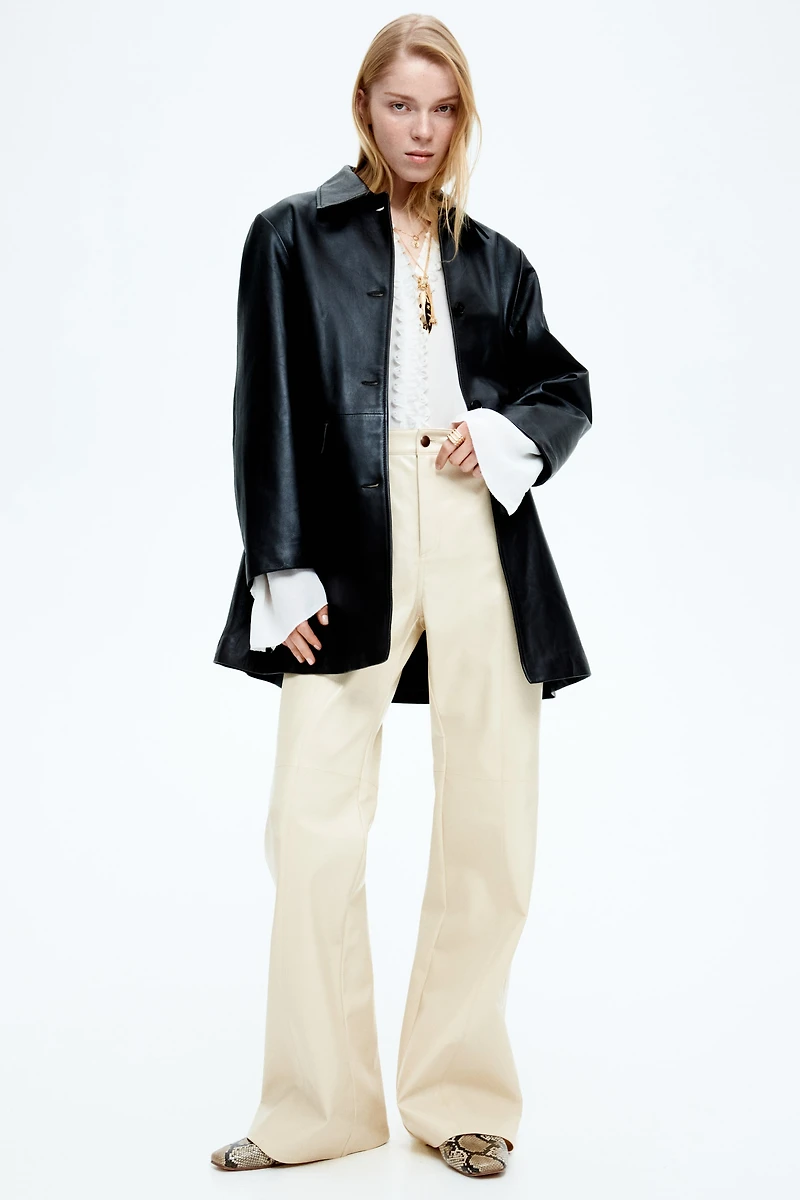 Pantalon en tissu enduit