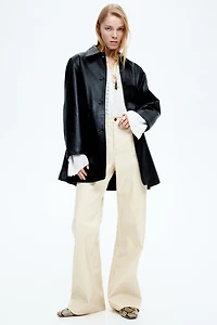 Pantalon en tissu enduit