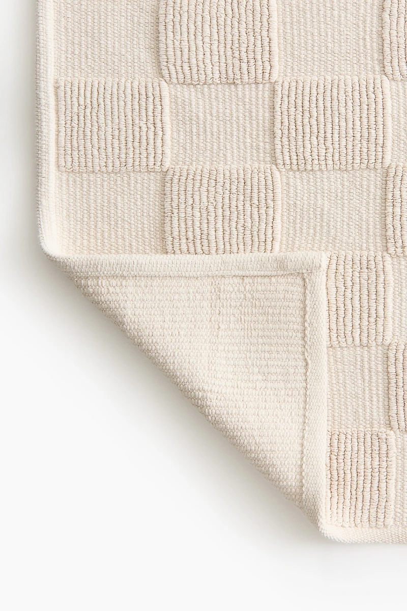 Tapis de bain à carreaux