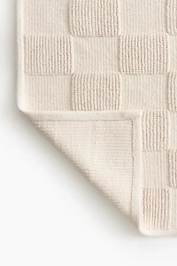 Tapis de bain à carreaux