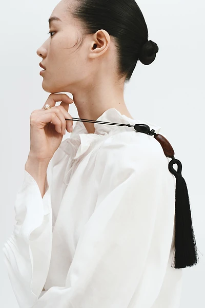 Bijou de sac avec gland