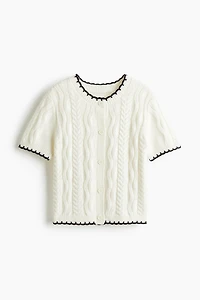 Gilet en tricot torsadé