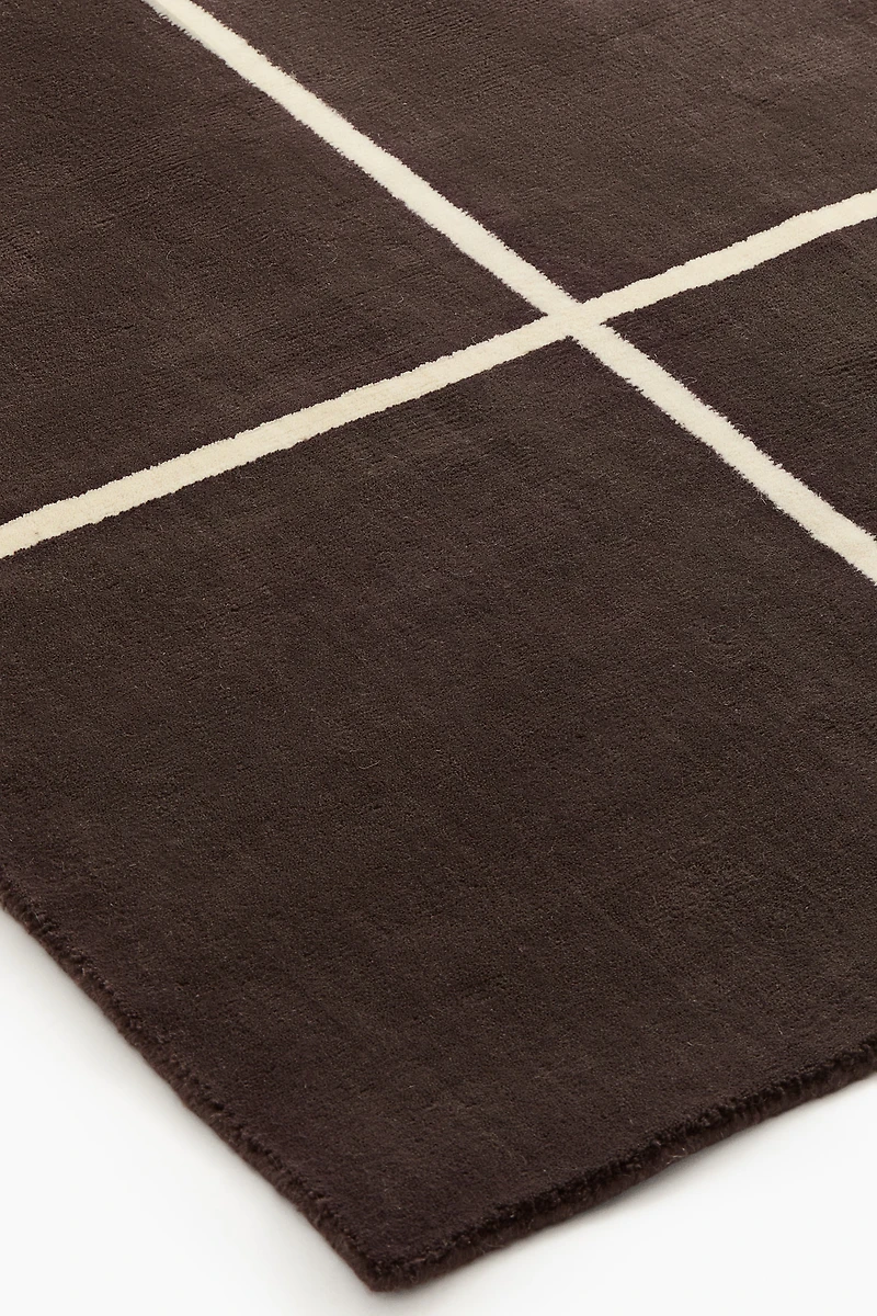 Grand tapis en laine mélangée