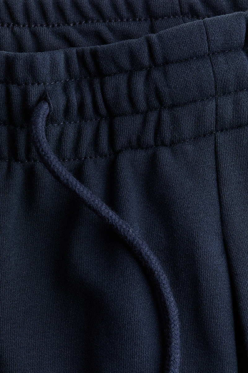 Pantalon avec cordon de serrage et plis