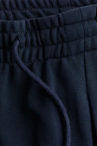 Pantalon avec cordon de serrage et plis