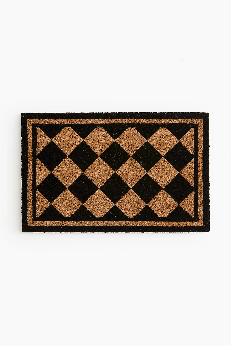 Paillasson en fibre de coco à motif