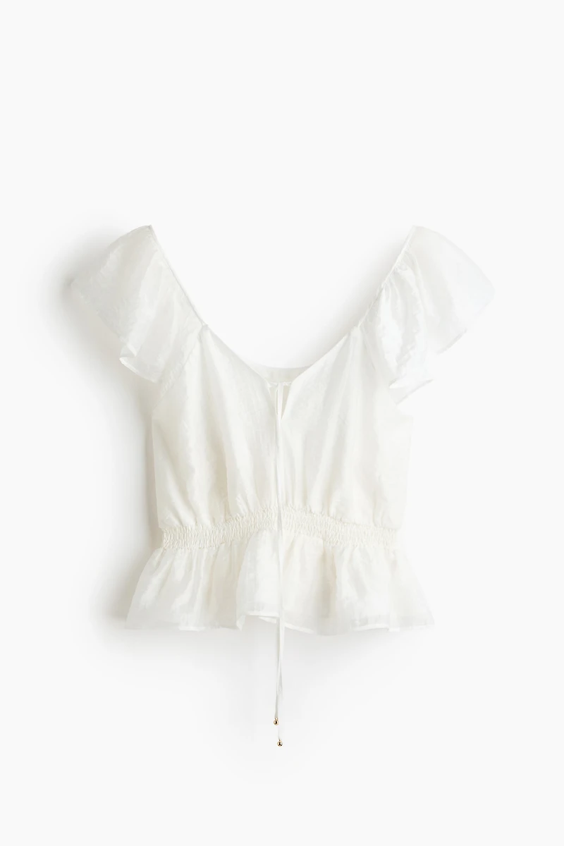 Blouse à manches volantées avec basque