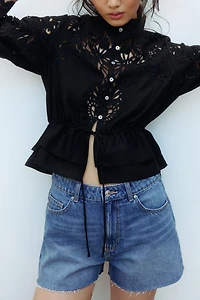 Raw-edge denim shorts