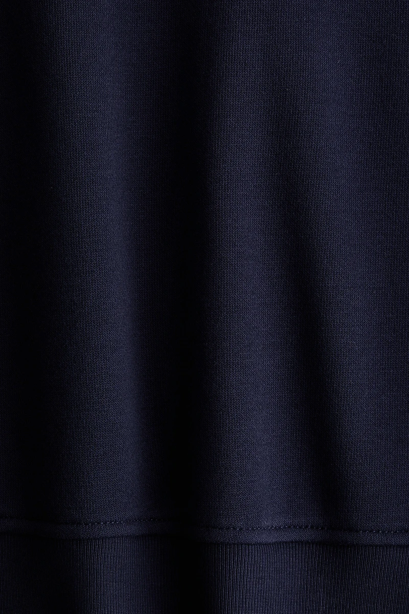 Chandail col à fermeture éclair et motifs