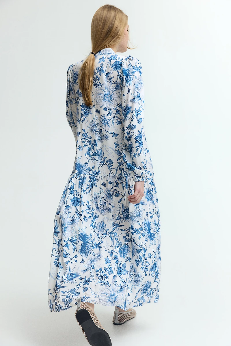 Robe longue à manches bouffantes