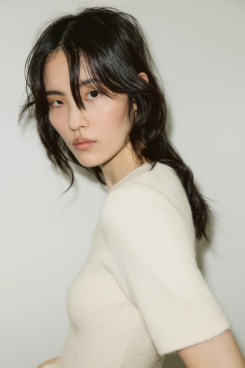 Haut péplum en tricot côtelé