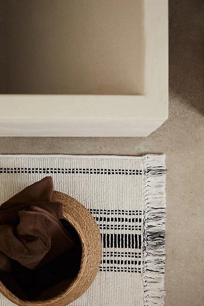 Tapis de bain frangé en coton