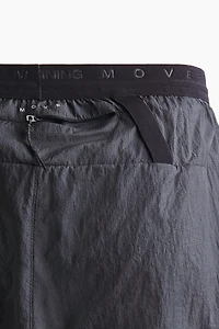 Short de course léger 2 en 1​DryMove™