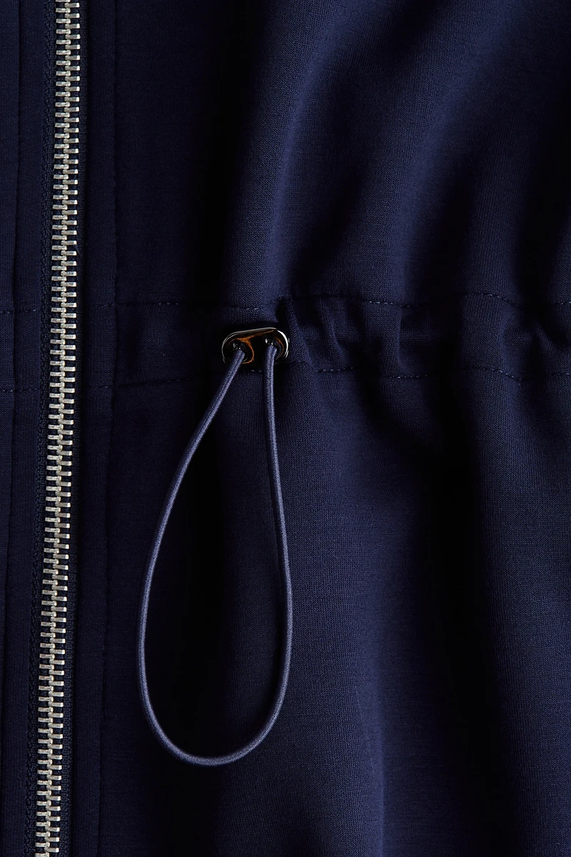 Chandail péplum à fermeture éclair