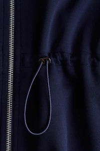 Chandail péplum à fermeture éclair