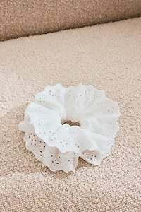 Cache-élastique avec broderie anglaise