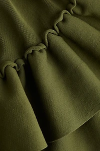 Robe en tricot à bord volanté au bas