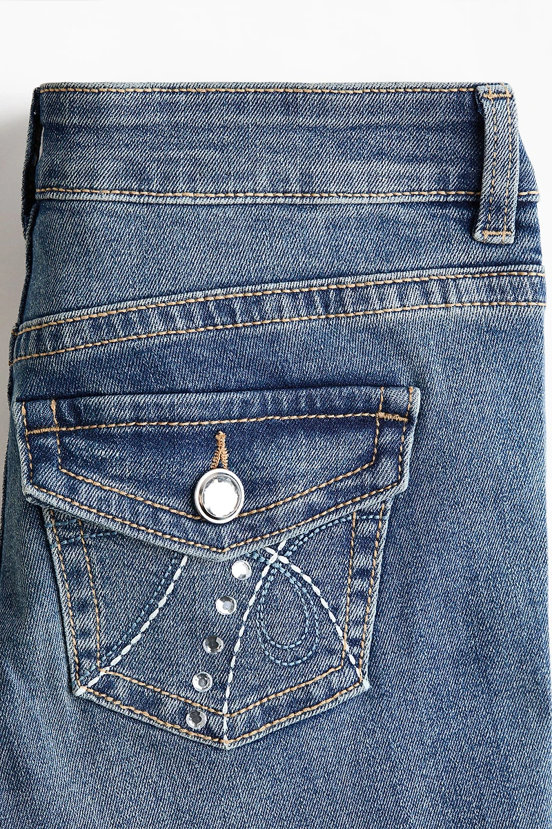 Jean taille basse jambes évasées