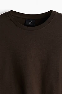 T-shirt flottant à l'aspect délavé
