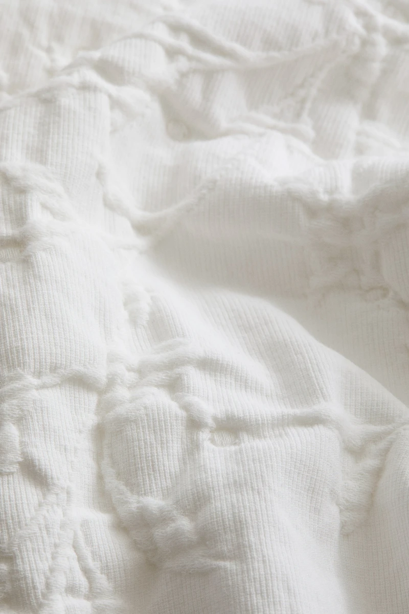 Housse de coussin en tissu jacquard