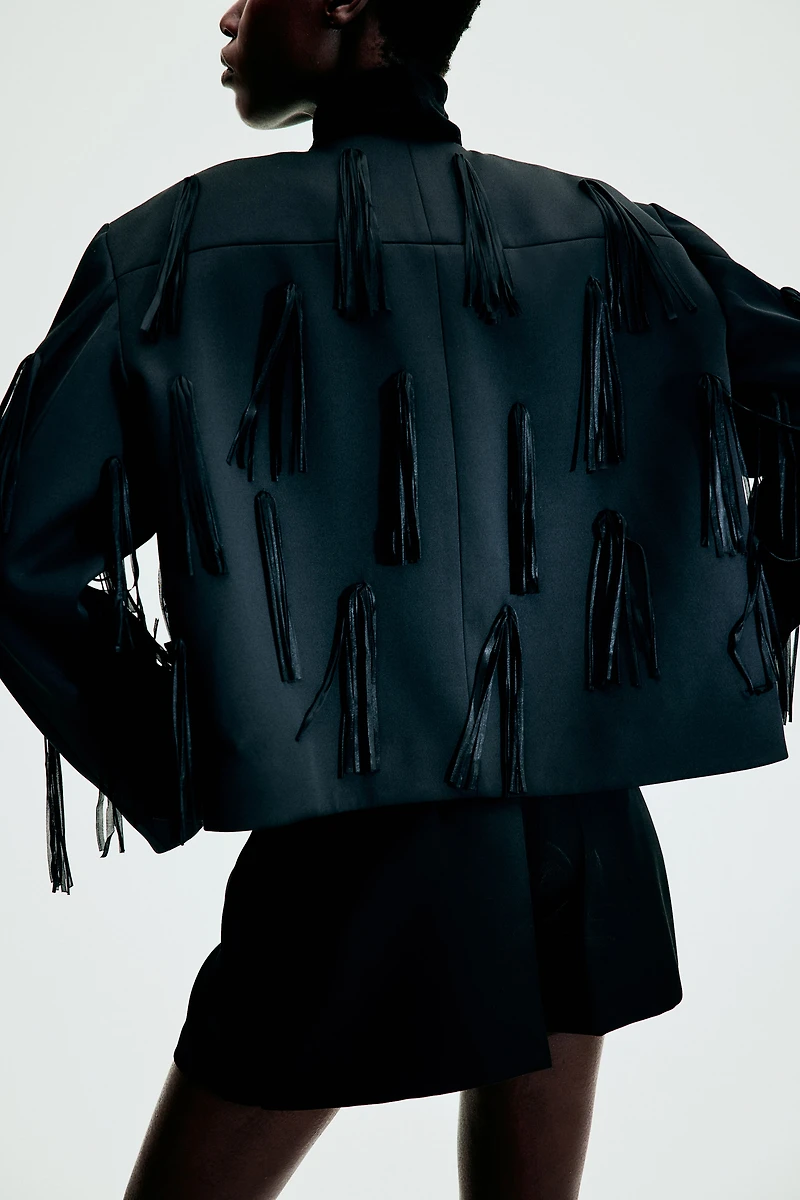 Veste frangée