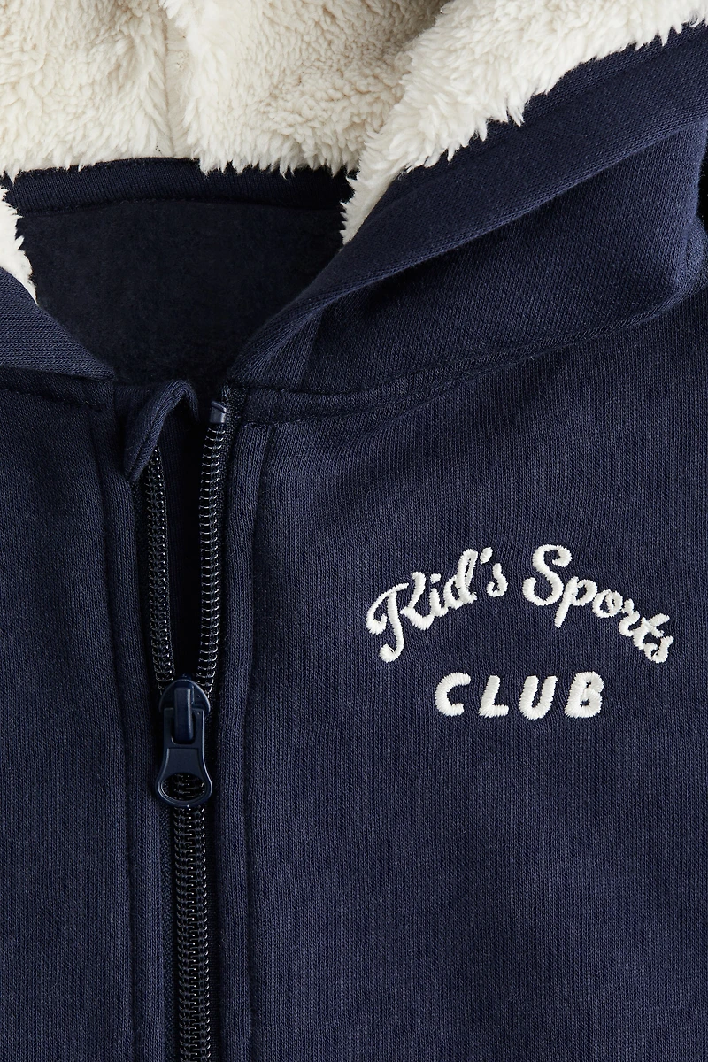 Veste à capuche fermeture éclair détails brodés