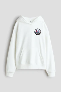 Chandail à capuche ample avec motif