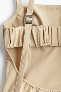 Low-back Dress with Pleated Skirt