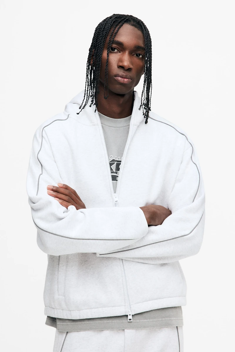 Veste à fermeture éclair ample avec capuchon