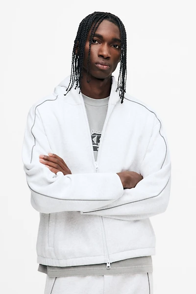 Veste à fermeture éclair ample avec capuchon