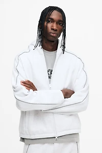 Veste à fermeture éclair ample avec capuchon