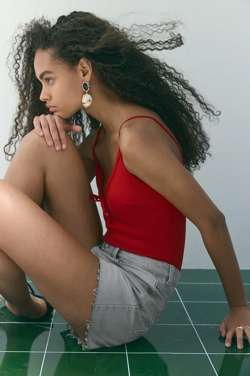 Raw-edge denim shorts