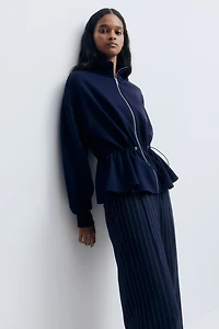 Chandail péplum à fermeture éclair