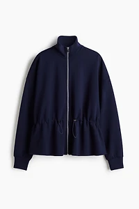 Chandail péplum à fermeture éclair