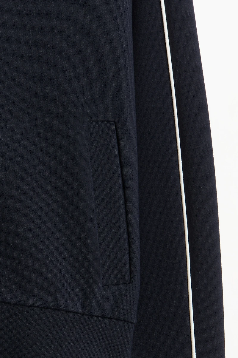 Veste de survêtement avec passepoils