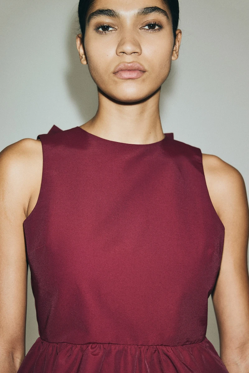 Haut péplum avec détail à nouer