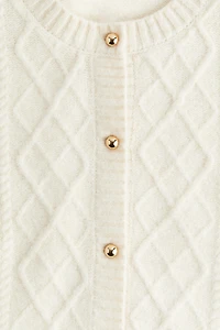 Gilet en tricot torsadé